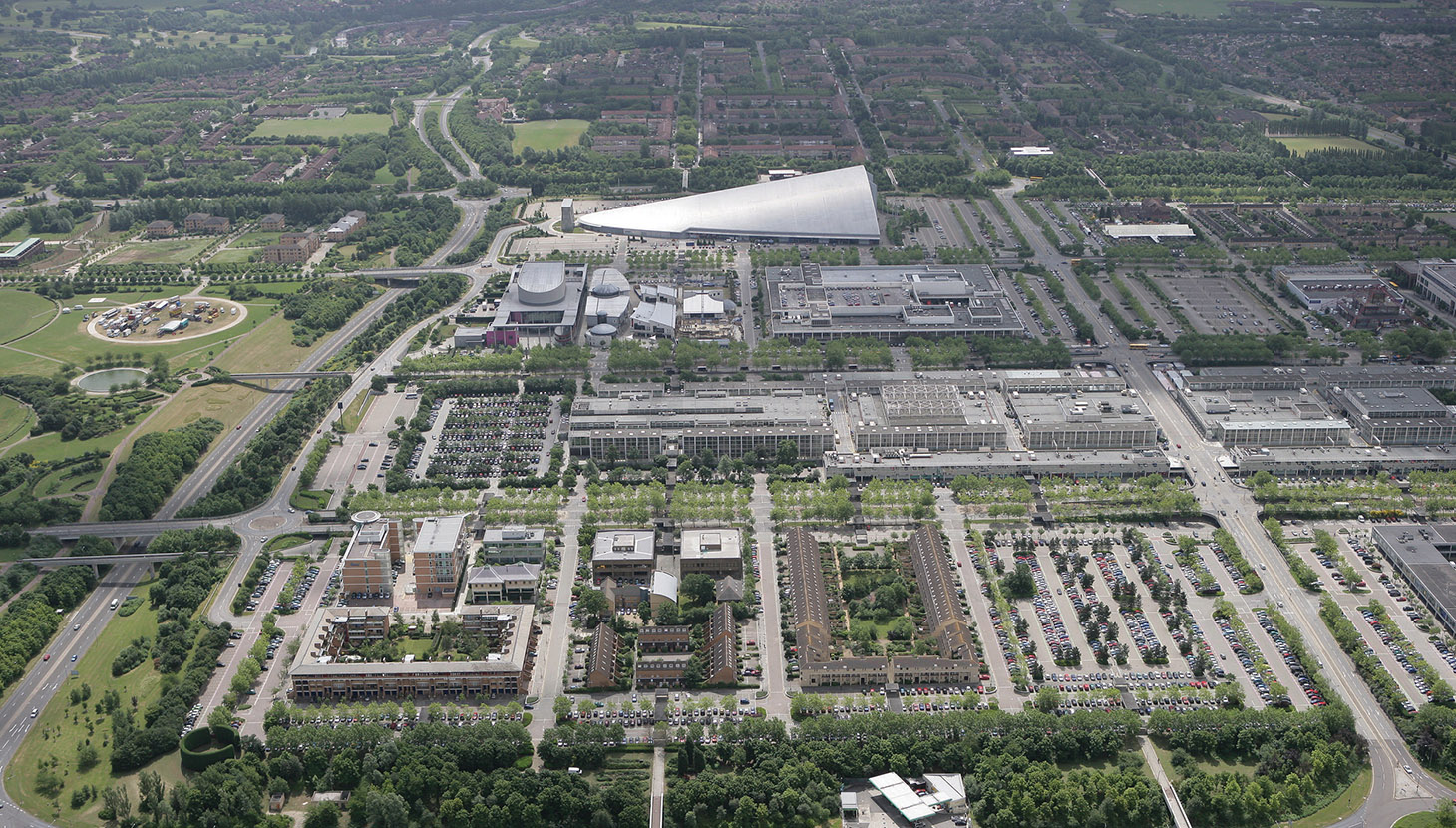 Aerial view of an industrial complex with surrounding residential areas.