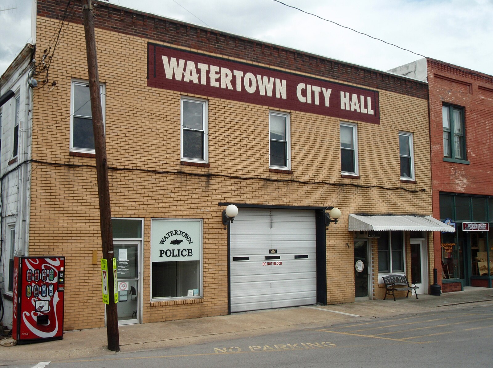 Watertown City Hall building with police signage.