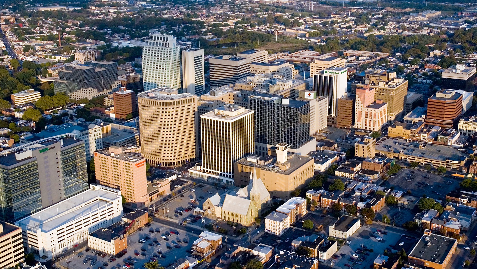 Aerial view of a city's downtown with tall buildings and urban landscape.