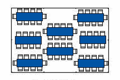 Floor plan of a room with multiple rectangular tables and chairs arranged in rows.