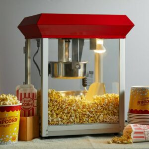 Classic movie popcorn machine with freshly popped corn and popcorn containers.