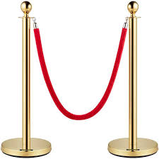 Gold stanchions with a red velvet rope barrier.