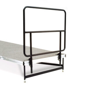 Metal bed rail attached to a bed frame for safety.